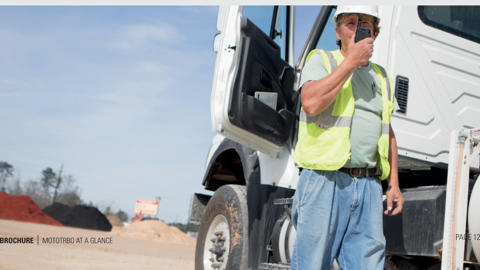 Field technician using radio communication near energy infrastructure